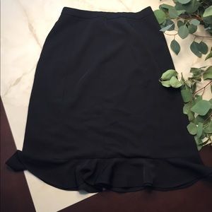 Knee length black skirt